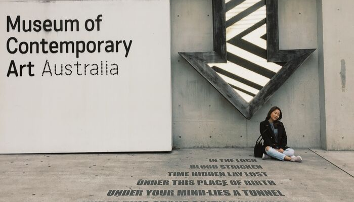 CDU student Pattarawadee Chatleelawat sits in front of the Museum of Contemporary Art in Sydney