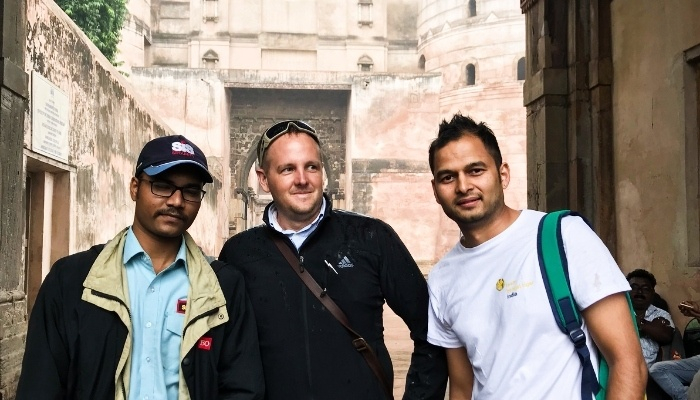 CDU student Dion Morrow with two peers in India