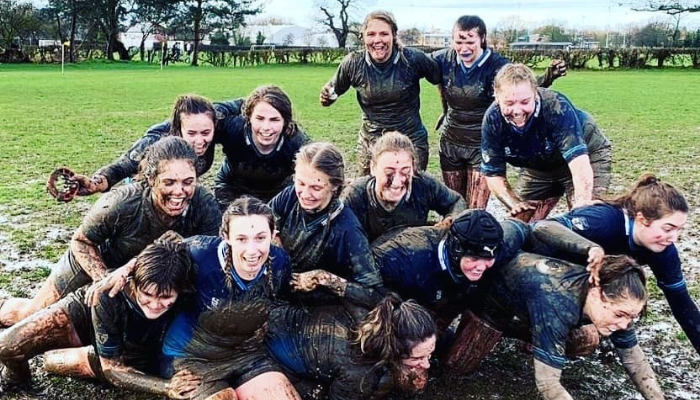 CDU student Lucy Lockhart on the rugby field with her teammates 