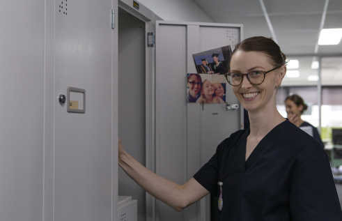 CDU nursing student at her locker in a hospital