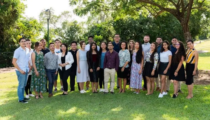 Coco standing with her friends.