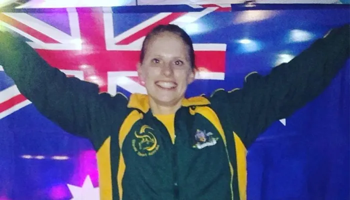 Saga Wessman holding the Australian flag at Seoul