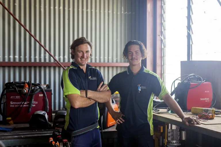 Yron smiling with his apprentice