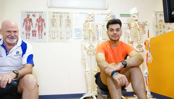 Emmanuel sitting in an exercise science class