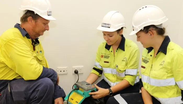 CDU VET students Stacey and Olivia working on an electrical switchboard