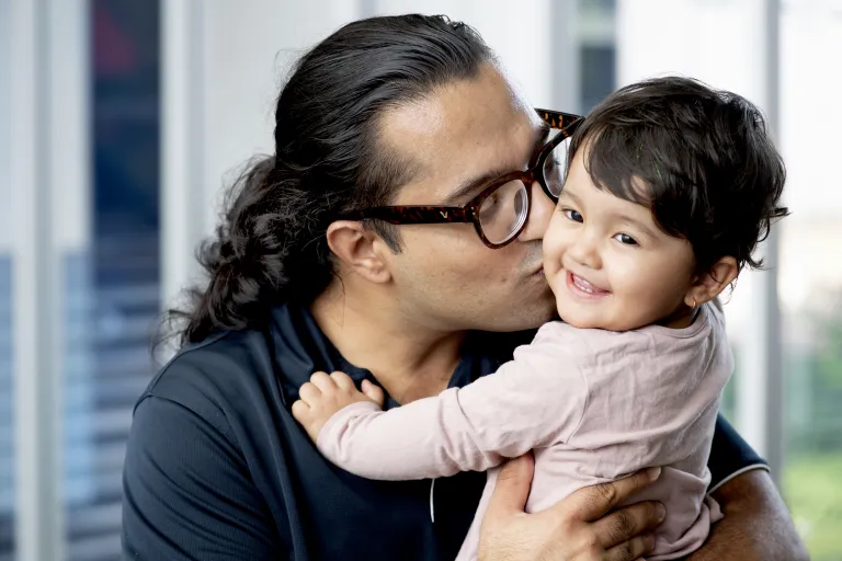 BP kissing his laughing daughter on the cheek