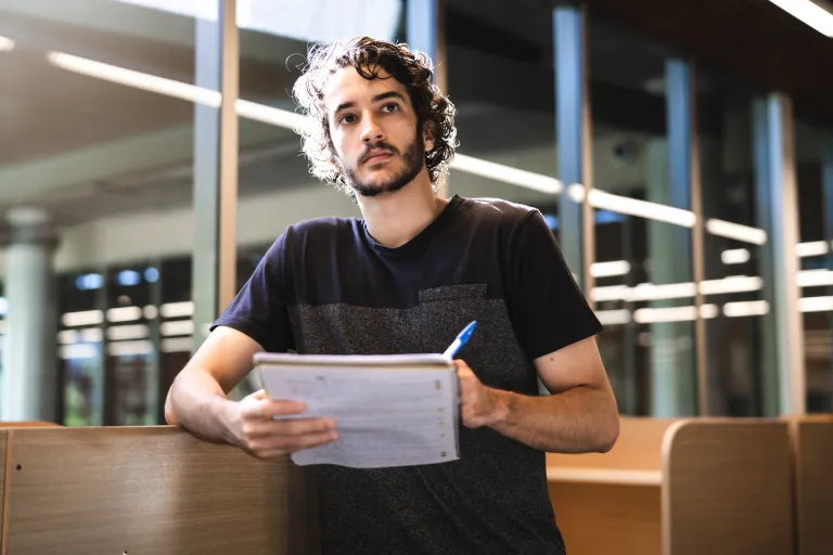 CDU student Nicholas Glinatsis in the library