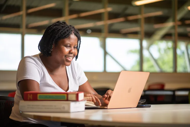 Law student Sizol at Casuarina campus library