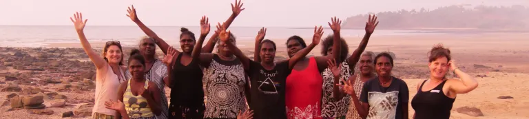 Group of people waving at camera