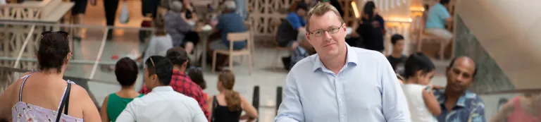 People riding escalator