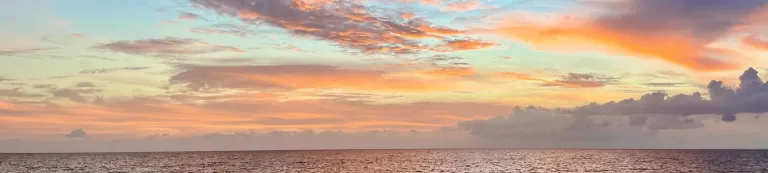 Clouds at sunset over the open sea