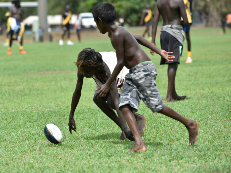Kids plays football in remote Aboriginal community 