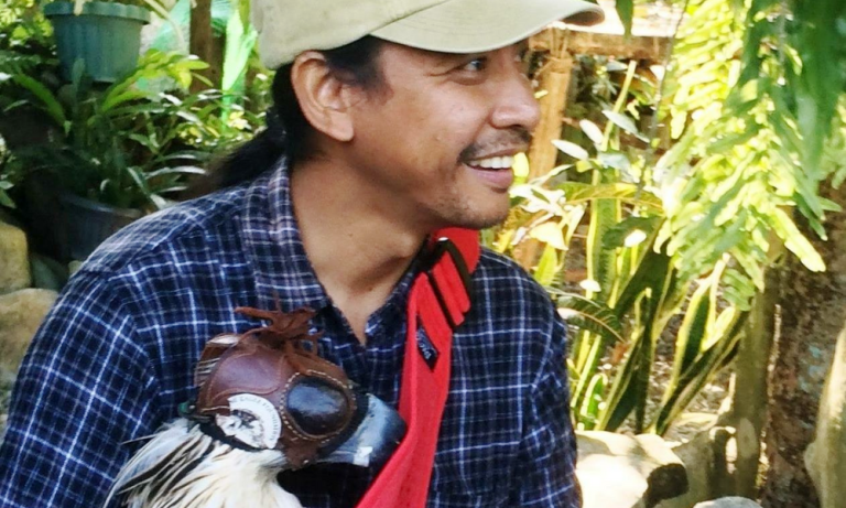 Dr Jayson Ibanez with a Philippine eagle