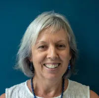 Karen Gibb, head and shoulders, wearing sleeveless white blouse