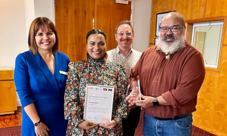 Priscilla receiving First Nations social work award