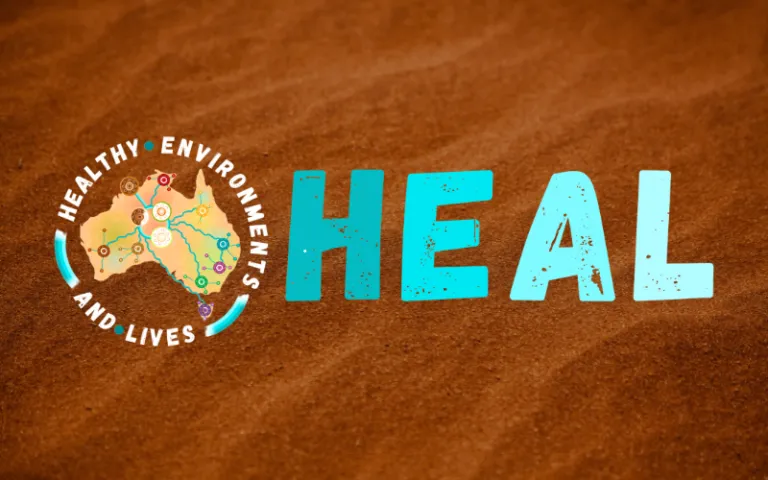 HEAL Network logo on back ground of orange desert sand