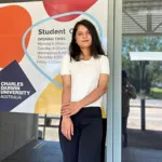 Prakriti Paudel MPP Student smiling and standing at casuarina campus