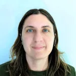 Stephanie Bagala, head and shoulders, against light blue background