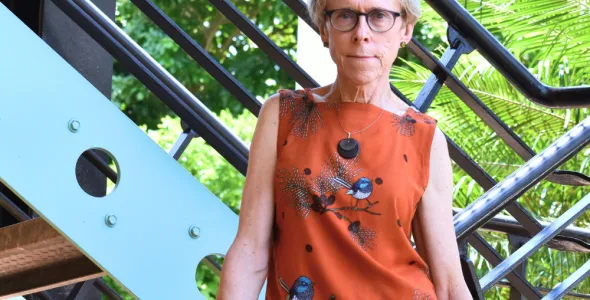 Professor Kim Humphery standing on a Northern Institute staircase