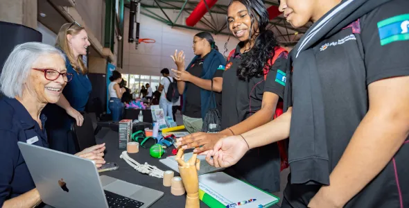 Students exploring stalls at the Faculty of Health expo.