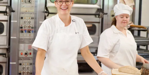 Two students working in a bakery