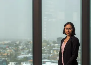 CDU alumni in corporate attire looking confident