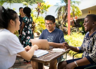 A multicultural group working to solve community problems