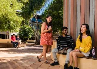 International students sitting together smiling