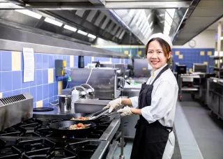 Culinary arts student in commercial kitchen