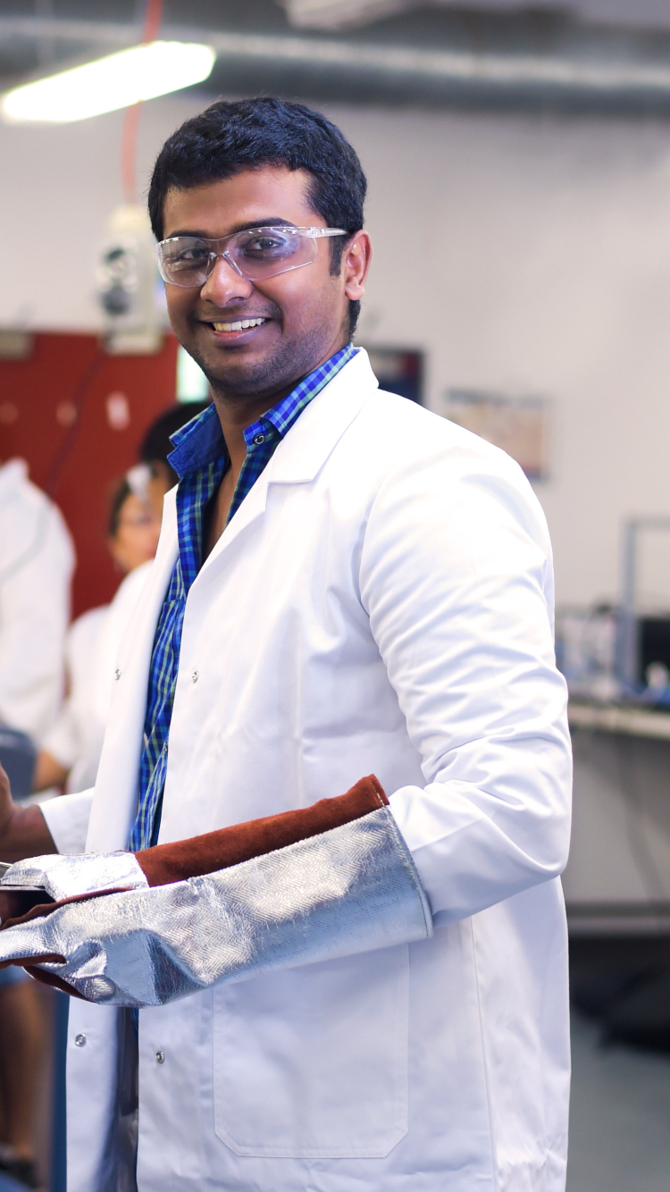 Engineering student in lab coat