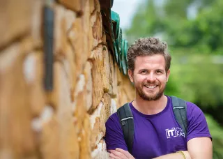 IT code fair student smiling at the camera