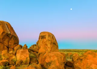 round boulders and skyline at dusk 