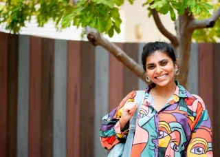 Arts student walks near library