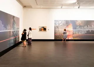 Gallery visitors view YOU ARE HERE – an exhibition by Therese Ritchie, 2021.