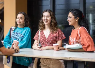Image of a group of students around a table