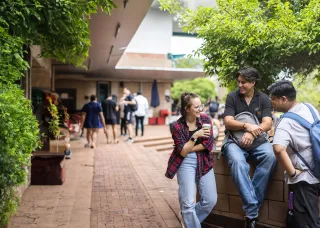 group of three on a wall at orientation