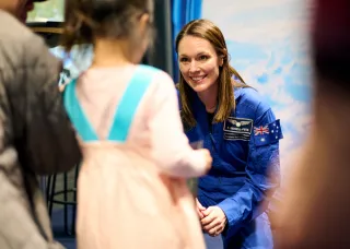 Australian Astronaut greets child