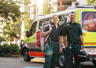 two paramedics standing in front of ambulance in Darwin