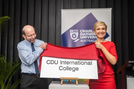 CDU Vice Chancellor Prof  Simon Maddocks unveils the CDU international College plaque with UP Education CEO of University Partnership's Marnie Watson.