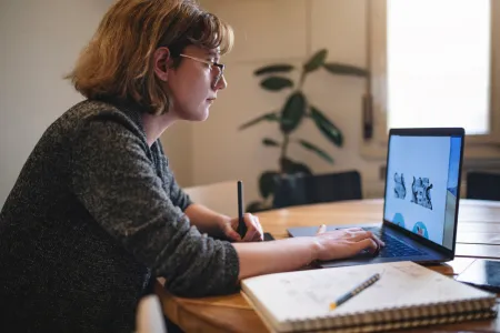 Woman looking at her laptop