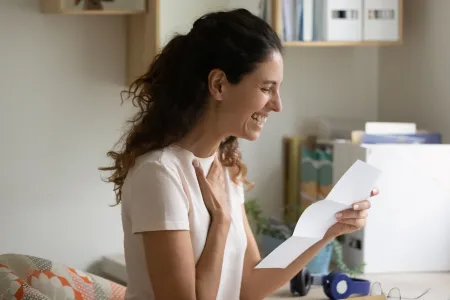 Women receiving an approved application and smiling