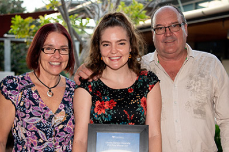 CDU student Courtney Stanwix, seen here with her parents, received the Pharmaceutical Society of Australia Best Academic Achievement Award.