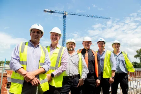 CDU Vice Chancellor Professor Scott Bowman, NT Minister for Jobs and Training Paul Kirby and Halikos construction company mark the major construction milestone for CDU's new $250m education and community precinct