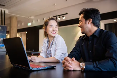 student talk with staff