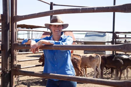 Claire Dennerley on-station with cattle.