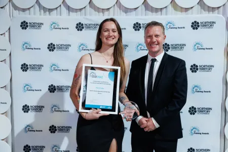 Charles Darwin University (CDU) students were among the honourees at the Northern Territory Training Awards gala held on September 3 at the Darwin Convention Centre. Pictured; Austin Asche Apprentice of the year award winner Mary Coulter and Minister for Business, Jobs and Training, Paul Kirby. 