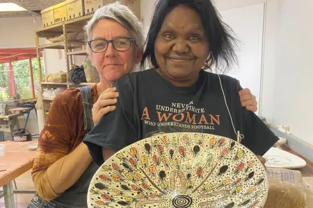 A Purple House patient creates ceramic art at CDU. 