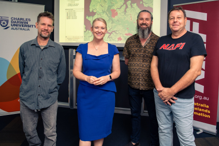 New funding will look to develop satellite fire mapping tech to help manage what happens on the ground. Pictured L-R CDU Research Dr Rohan Fisher, Minister for Industry Nicole Manison, NAFI Developer Tom Lynch and CDU spatial software engineer Dr Patrice Weber. 