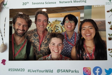five grinning people in a frame saying 20th savanna science network meeting