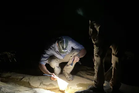 researcher sampling ground water